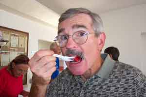 Bill stuffing his mouth